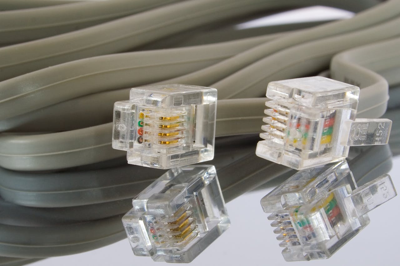 Detailed image of Ethernet cables and connectors, ideal for tech themes.